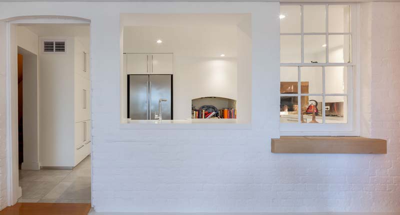 Internal view - looking towards kitchen ( original brickwork exposed )