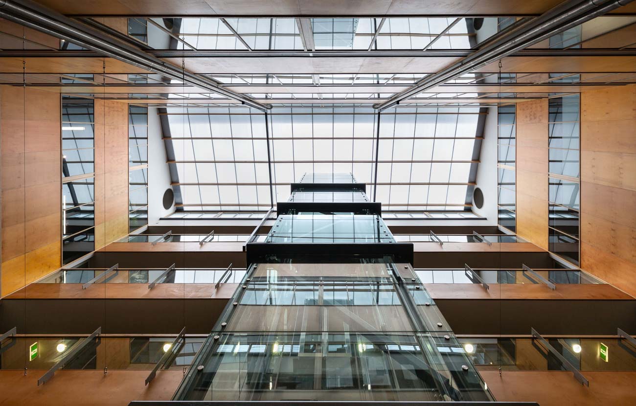 View of looking up the atrium space ( new glass lift )